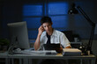© Stella 16 - Businessman working overtime at his desk late at night