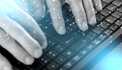 Wall Mural - Hands typing on laptop computer; light effect