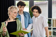 © LIGHTFIELD STUDIOS - Collaboration and creativity thrive among youth in a modern office environment