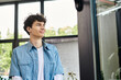 © LIGHTFIELD STUDIOS - Young professional focused on growth and success in a modern workspace environment