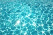© Creatives - Turquoise water surface, sunlit ripples (1)