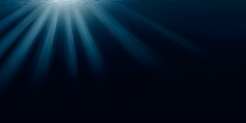 A dark blue background with rays of light shining down, creating an underwater effect. 