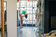 © Austockphoto - Boy holding bucket waiting for balls to eject from pipe vacuum contraption