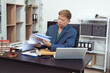 © Worapon - Judge, male lawyer discuss legal services for businessmen, give advice on contracts, plan court cases.