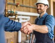 © cik - Agreement Sealed Smiling Contractor Shakes Hands in Utility Room.