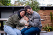 © Austockphoto - 30something couple hugging their dog