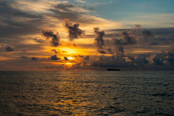 Wall Mural - Sunrise sky horizon. Sea sunset view. Cloudy sunset sky and seascape at summer vacation. Skyscape with sea sunrise. Calm horizon at sea nature. Bora bora. Romantic summer vacation on beach seascape