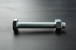 © New Africa - One metal bolt on dark wooden table, closeup