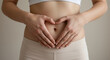 © Sunnn - Woman's Hands Forming Heart on Stomach Promoting Healthy Gut, Probiotics, Leaky Gut & Digestive Health