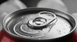 © BoldStock - Close-up of a red soda can lid with water droplets reflecting light