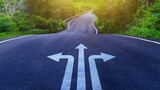 Arrows on asphalt road ground with three direction arrow choices, left, right or move forward on Curve of the road, difficult decision making concept, Motivation and growth.