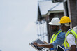 © ultramansk - A senior electrician provides hands on training to a young apprentice on solar technology. Building the next generation of skilled labor for the renewable energy and construction trades.