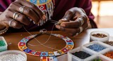 Close-up of Maasai woman creating a beaded necklace, showcasing traditional African jewelry making
