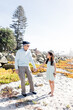 © Cavan Images - Grandfather & Granddaughter Holding Hands on Beach in Coronado