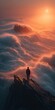 © Adli - Sunrise over a sea of clouds, a lone figure on a mountain peak