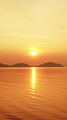 Wall Mural - Aerial view of the golden light on sea surface,Amazing waves ocean at sunset or sunrise sky background