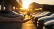 © SkyPix - Car keys being handed over symbolizing vehicle purchase at sunset