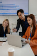 © Chadaporn - businessman is discussing with his team about business, group of entrepreneur are brainstorming in the office, they are meeting in the company, accounting, marketing, financial