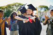© Rido - Friends hugging and celebrating during graduation ceremony