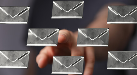 Abstract image of a hand selecting digital email messages.  Great for technology, communication, and digital marketing concepts.