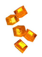 Wall Mural - Yummy orange jelly cubes falling on white background