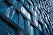 © xartproduction - Modern Building Facade with Blue Glass Windows and Steel Frames
