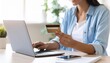 © Abstract Design - Young Woman Engaged in Online Shopping Using Credit Card While Sitting at Her Laptop in Cozy Room