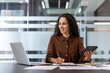 © Liubomir - Confident Professional Women Working in Modern Office Environment