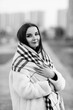 © shymar27 - Portrait of a young beautiful long-haired girl in warm clothes. Black and white photo.