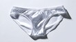 © yasiryasir - Shiny, silky white panties centered on light backdrop; casts soft shadows