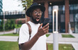 © BullRun - Young African-American man reacts with astonishment to something on smartphone screen, capturing raw emotion and immersive tech experience in modern mobile reality.