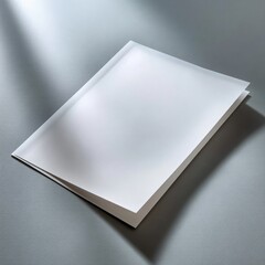 Wall Mural - Open Blank White Document on Gray Surface