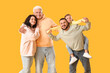 © Pixel-Shot - Happy family on yellow background