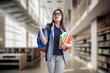 © BillionPhotos.com - Young woman student in library, preparing for exam.
