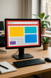 © Freelance - A computer monitor displaying a website layout on a wooden desk with a keyboard, mouse, and potted plants in an office setting.