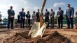 © Design Stock - Groundbreaking ceremony with shovel in dirt and dignitaries in background celebrating new construction project start