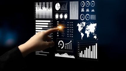 Wall Mural - a person interacts with a sleek digital touchscreen displaying various charts and graphs, highlighti