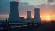 © Ariful - Cooling towers industrial complex at sunset power plant