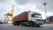 © Denis Yevtekhov - A container truck at a ship port with cranes loading cargo, representing logistics and transportation, container logistics, port operations, global shipping, import-export, industrial transp