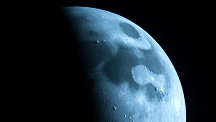 Detailed view of the moon's surface with craters, glowing blue against the darkness of space.