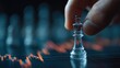 © NordSueden - Glass chess piece placed on a financial chart, strategy and investment concept