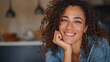 © Johannes - portrait of a beautiful mid adult woman smiling at home middle aged african woman in casual looking at camera with copy space cheerful mixed race girl relaxing at home with big laugh no logos no bran