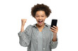 © Adobe - Excited person with cellphone smiles. This image is ideal for ads, blogs, or social media.