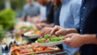 © Kateryna - Consulting firm team building event with BBQ stations and outdoor dining setup fostering collaboration among colleagues in relaxed corporate retreat atmosphere blurred background