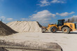 © dsheremeta - Wheel loader moving sand in concrete production plant