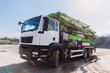 © dsheremeta - Concrete mixer truck parked at construction site on sunny day