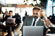 © Davor - Businessman working on laptop in coffee shop