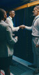 © peopleimages.com - Handshake, cybersecurity and team with people in server room for database, software engineer or partnership. Technician, collaboration and cloud computing with employees shaking hands for it contract
