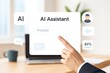 © JH45 - A hand points to a digital prompt interface of an AI assistant, highlighting user interaction and technology.