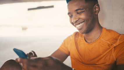 Fitness, man or relax with phone outdoor for workout break, text message or reading notifications. Happy athlete, black person or smartphone for social media, exercise rest or training app with space